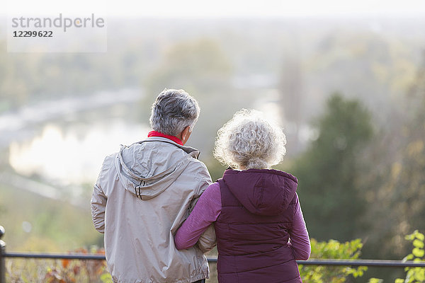 Active senior couple looking at view in nature