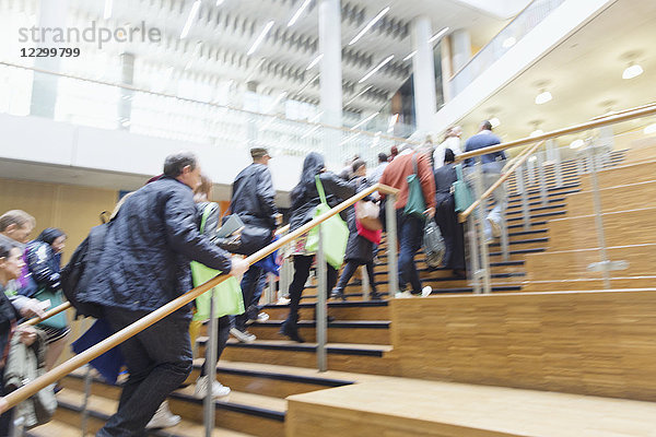 Business people ascending office stairs