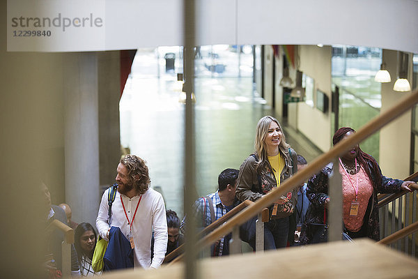 Business people ascending stairs