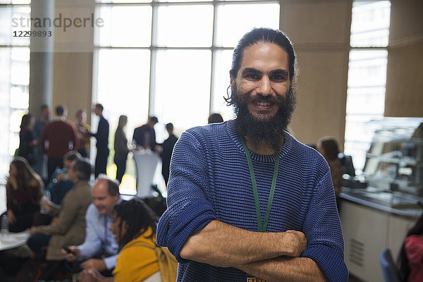 Portrait smiling man with beard at conference