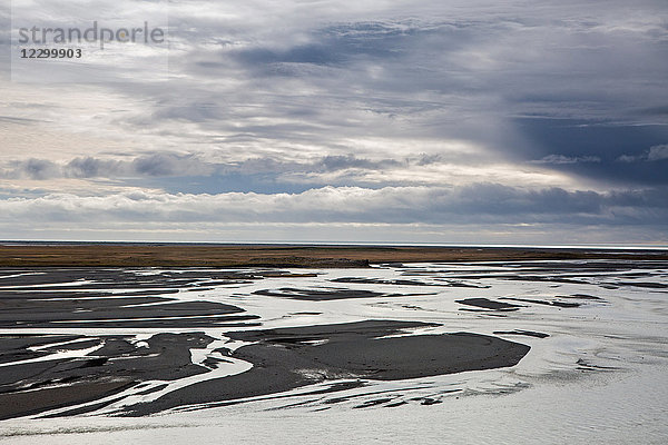 Clouds over low ocean tide  Stokksnes  Iceland