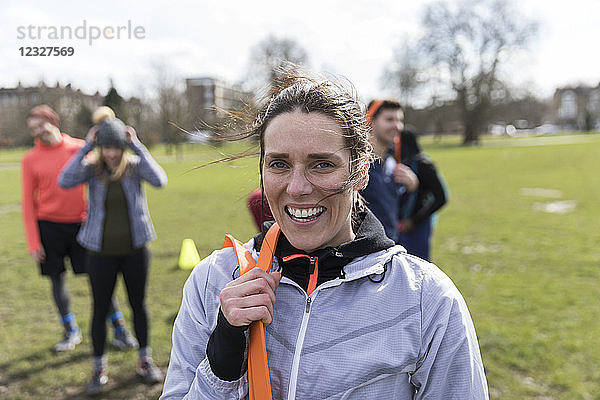 Portrait smiling  confident woman exercising in park