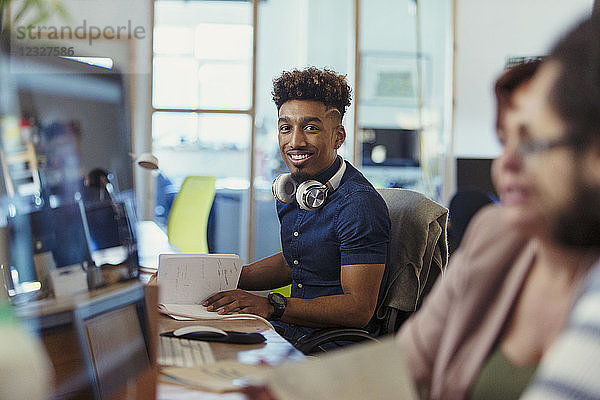 Portrait smiling  confident creative businessman working in office