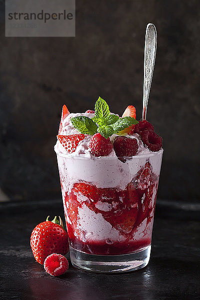 Dessert with whipped cream  strawberries and raspberries