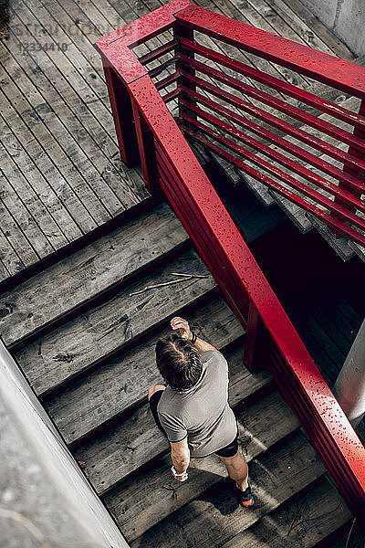 Athlete walking up stairs outdoors