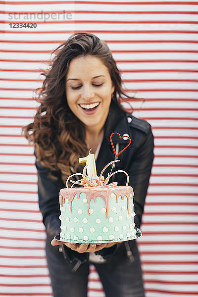 Woman presenting Birthday cake