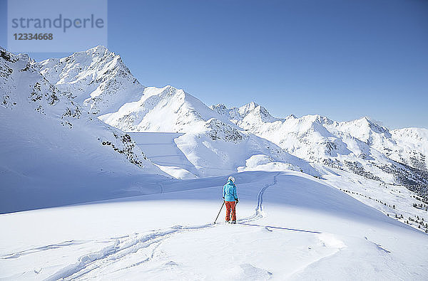 Austria  Tyrol  Kuehtai  female skier in winter landscape
