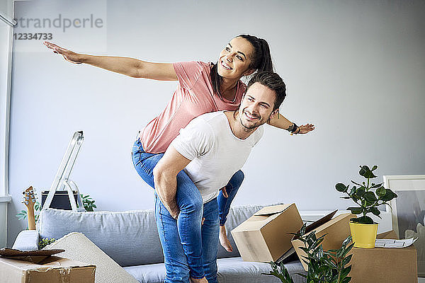 Carefree couple moving into new home