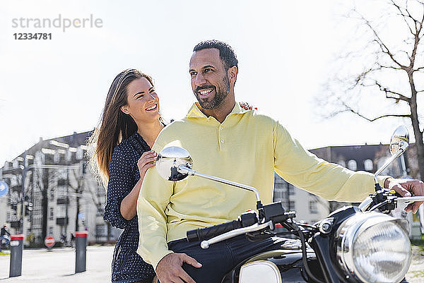 Happy couple on a motorbike