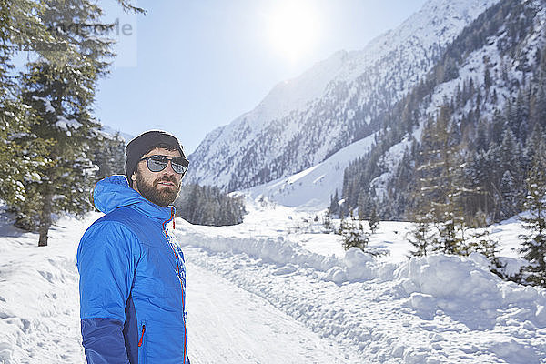 Portrait of man in snow-covered landscape