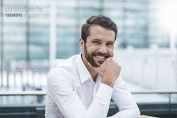 Portrait of smiling young businessman