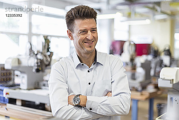 Portrait of smiling man in factory