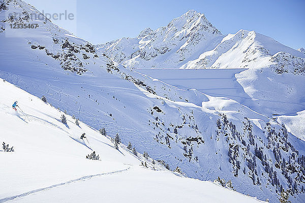 Austria  Tyrol  Kuehtai  couple skiing in winter landscape