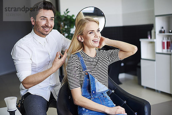 Happy woman at the hairdresser