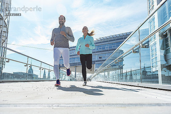 Couple running in the city