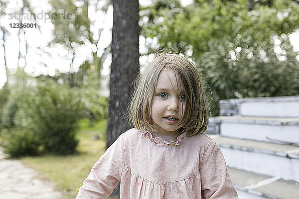 Portrait of little girl in the garden