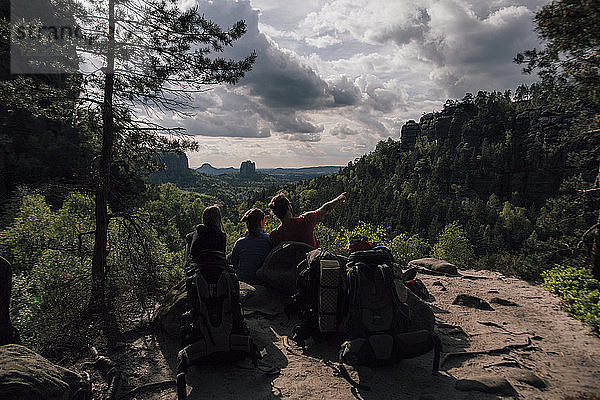 Germany  Saxony  Elbe Sandstone Mountains  friends on a hiking trip having a break