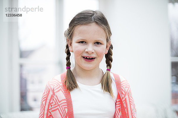 Portrait of smiling girl with braids