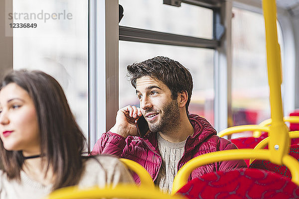 UK  London  portrait of young man on the phone in a bus