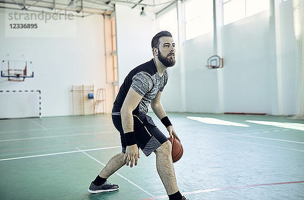 Man playing basketball  indoor
