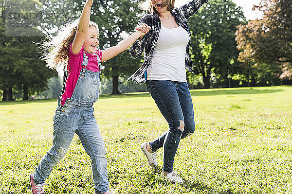 Happy mother with daughter in a park