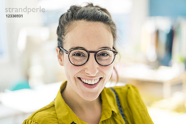 Portrait of happy young woman wearing glasses