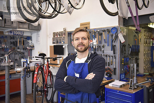 Bicycle mechanic in his repair shop  portrait