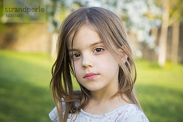 Portrait of little girl in the garden
