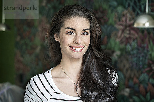 Portrait of a beautiful  smiling young woman