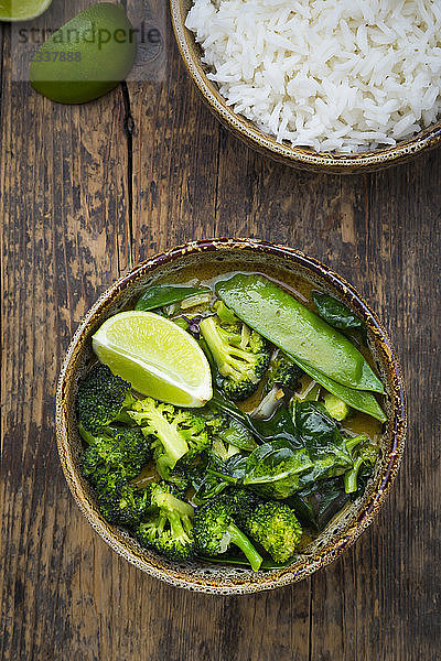 Green thai curry with broccoli  pak choi  snow peas  baby spinach  lime and bowl of rice