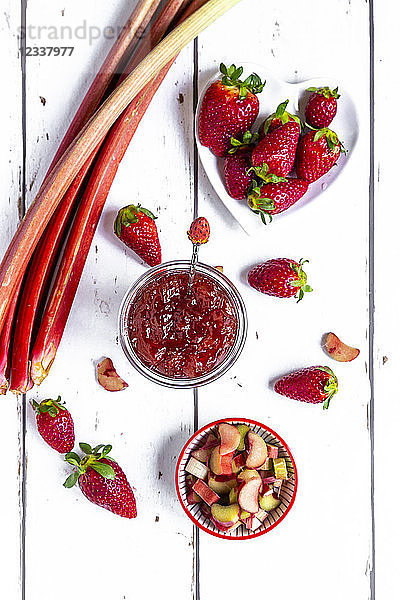 Glass of strawberry rhubarb marmelade  strawberries and rhubarb