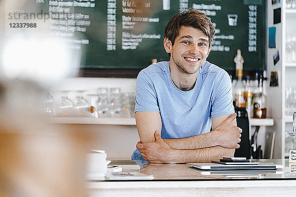 Portrait of smiling man in a cafe