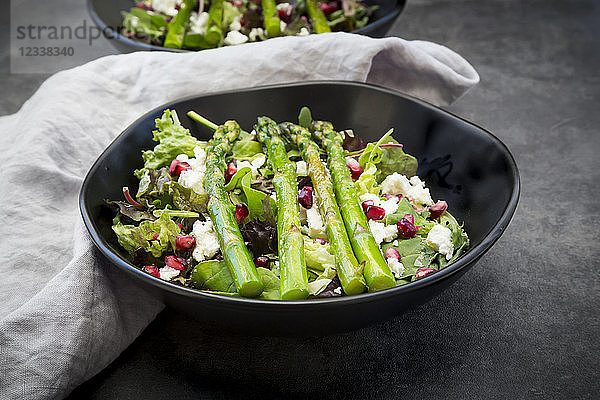 Mixed salad with fried green asparagus  feta and pomegranate seeds