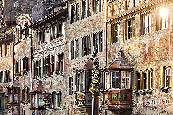 Switzerland  Stein am Rhein  Old town  historical houses at townhall square  fresco paintings  sculpture on fountain