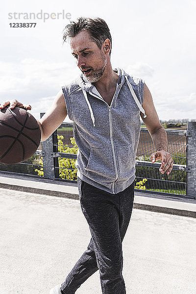 Man dribbling with basket ball