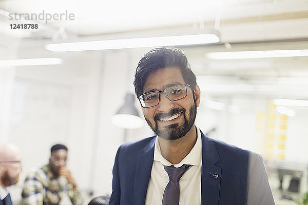 Portrait smiling  confident businessman in office