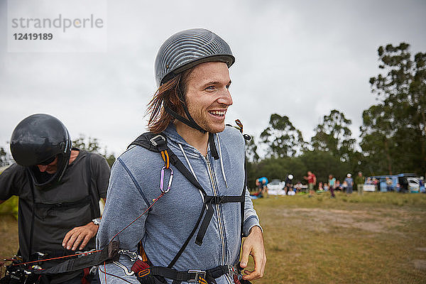 Smiling male paraglider