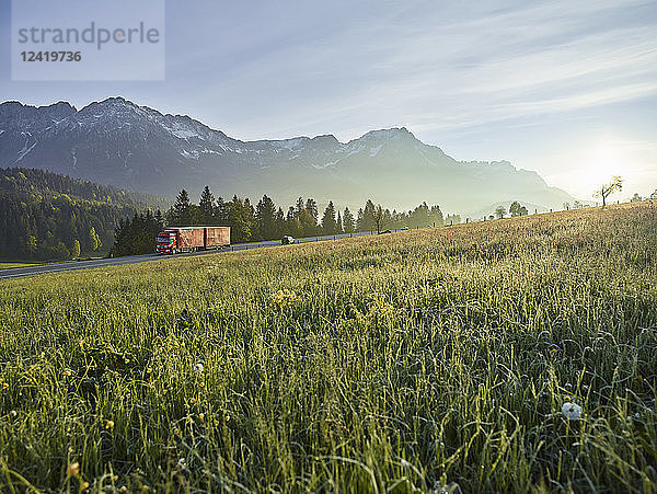 Austria  Tyrol  truck on country road in the morning light