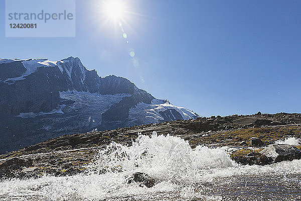 Austria  Carinthia  Großglockner peak and high alpine territory with stream  High Tauern National Park