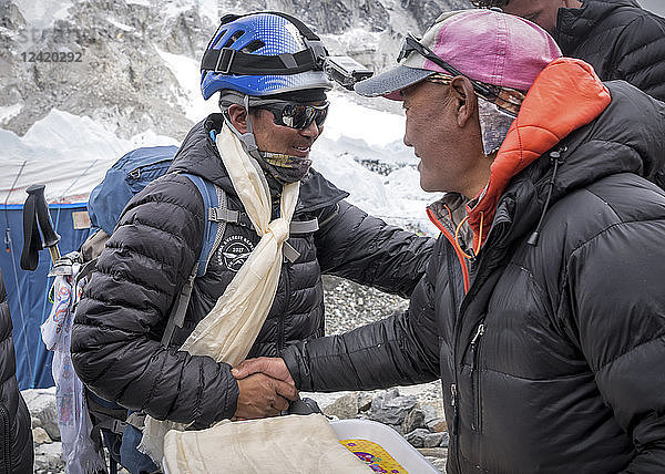 Nepal  Solo Khumbu  Everest  Sagamartha National Park  People greeting at the base camp