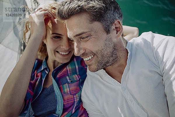 Happy couple on a sailing boat