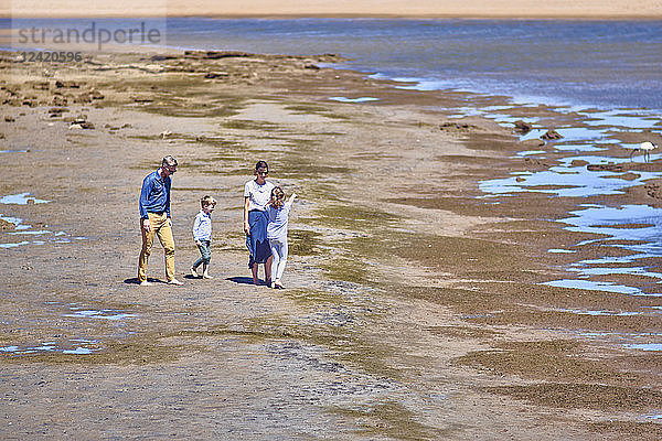 Australia  Adelaide  Onkaparinga River  family walking on the beach together