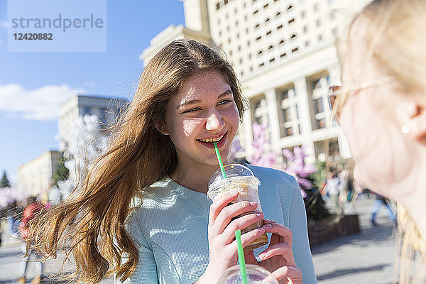 Russia  Moscow  teenage girls drinking a delicious frappe in the city