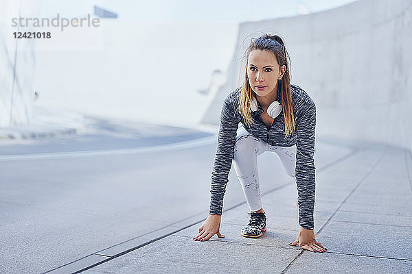 Woman stretching leg after jogging