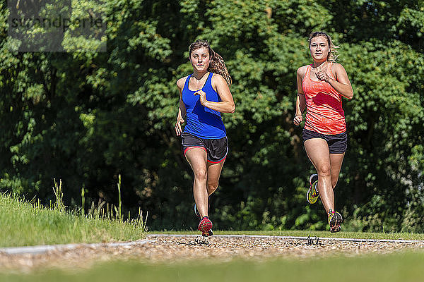Female joggers on woodchip trail
