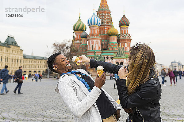 Russia  Moscow  multiracial couple eating icecream