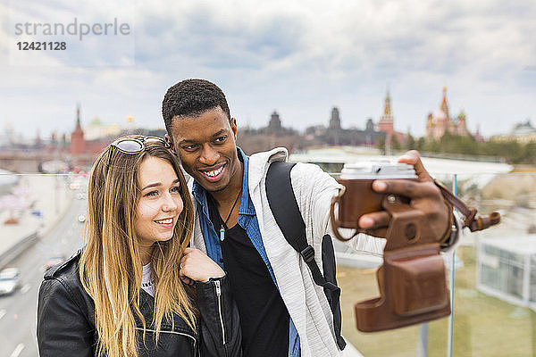 Russia  Moscow  couple taking a selfie and smiling