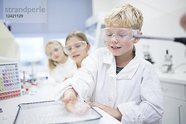 Pupils in science class experimenting