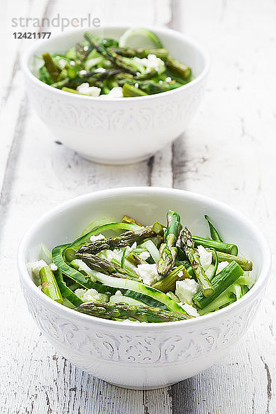 Green asparagus salad with helically coiled cucumber and feta cheese