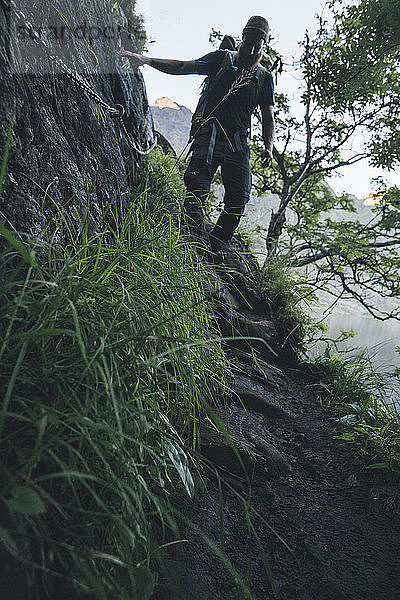 Norway  Lofoten  Moskenesoy  Young man hiking in the mountains